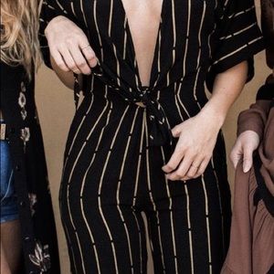 NWT bel Kazan black jumpsuit with golden striped small. Deep plunge neck